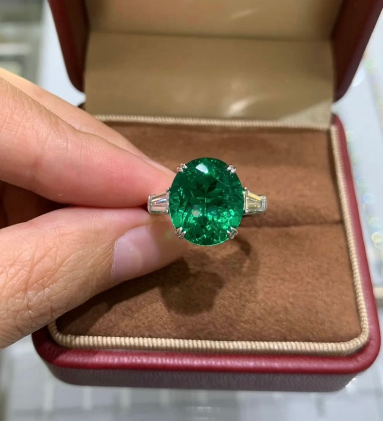 7 Carat Oval Emerald with Trapezoid Diamonds on 14Kt white gold