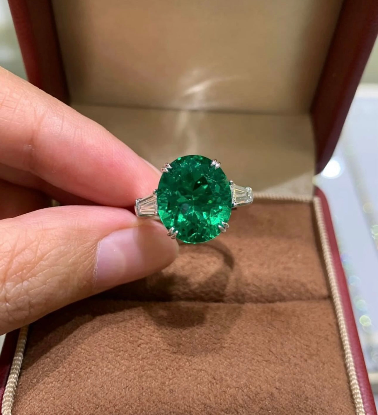 7 Carat Oval Emerald with Trapezoid Diamonds on 14Kt white gold